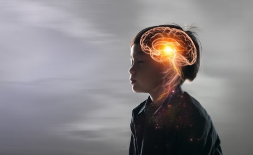 toddler, with a transparent image of his brain superimposed on his head