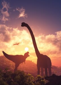 T. Rex, sauropod, and pterosaur silhouetted against rising sun