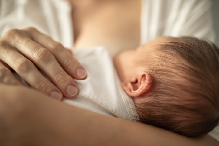 sleepy baby breastfeeding