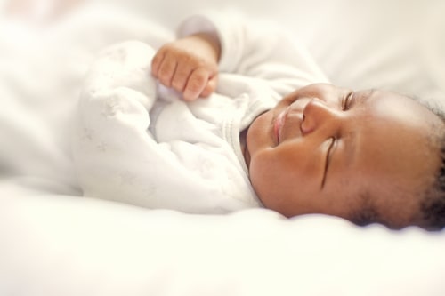 cute baby, taking a nap, smiling in her sleep