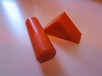 plastic shapes, a cylinder and a triangular prism