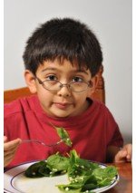 boy eating spinach 